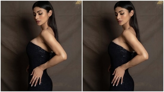 Mouni's strapless black gown features shimmering black sequin embellishments - placed all over the fabric. Additionally, the A-line silhouette of the skirt, the short train at the back, and the floor-sweeping hem length rounded off the design details of the ensemble. Lastly, the bodycon fitting accentuated the star's enviable curves.(Instagram/@imouniroy)