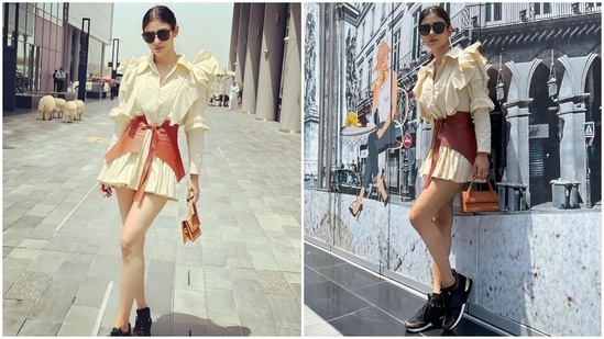 Earlier, Mouni had posted pictures of herself enjoying a day out in Dubai, United Arab Emirates. The star captioned her post, "It's so hot outside, just freeze me or burn me or whatever." It showed Mouni posing for the camera dressed in an off-white shirt dress teamed with a tan-coloured faux leather waist corset.(Instagram/@imouniroy)
