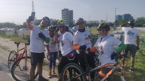 Group of cyclists from Greater Noida west reached near demolition site on Sunday morning and clicked pictures with soon to be demolished buildings.(Sunil Ghosh / Hindustan Times)