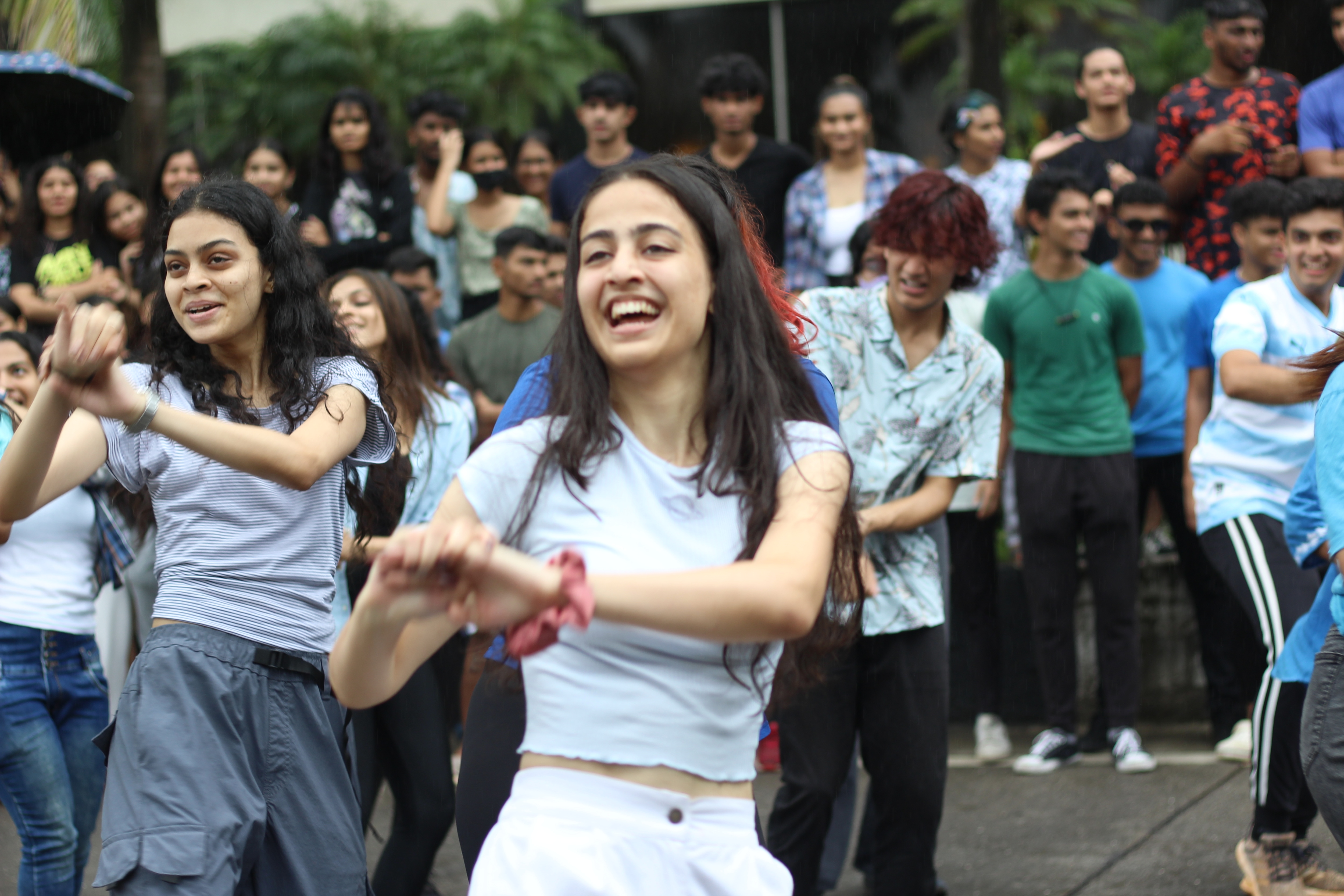 Students dance in a flash mob on Marine Drive