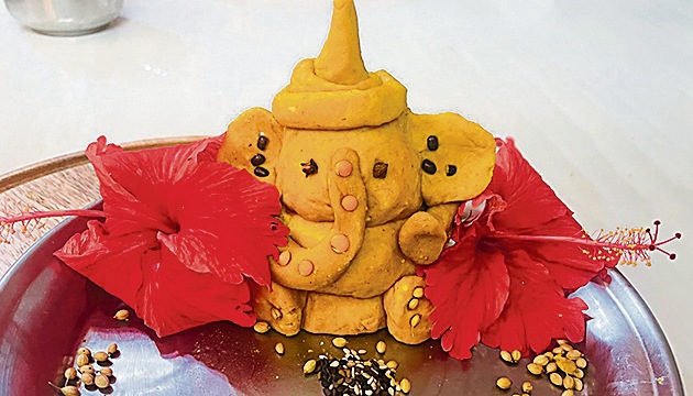 Gurugram-based artist Gurpreet Soni’s idol, representing the nine planets, is made using haldi, ghee, dhaniya seeds and dal. Gurugram-based artist Gurpreet Soni’s idol, representing the nine planets, is made using haldi, ghee, dhaniya seeds and dal.