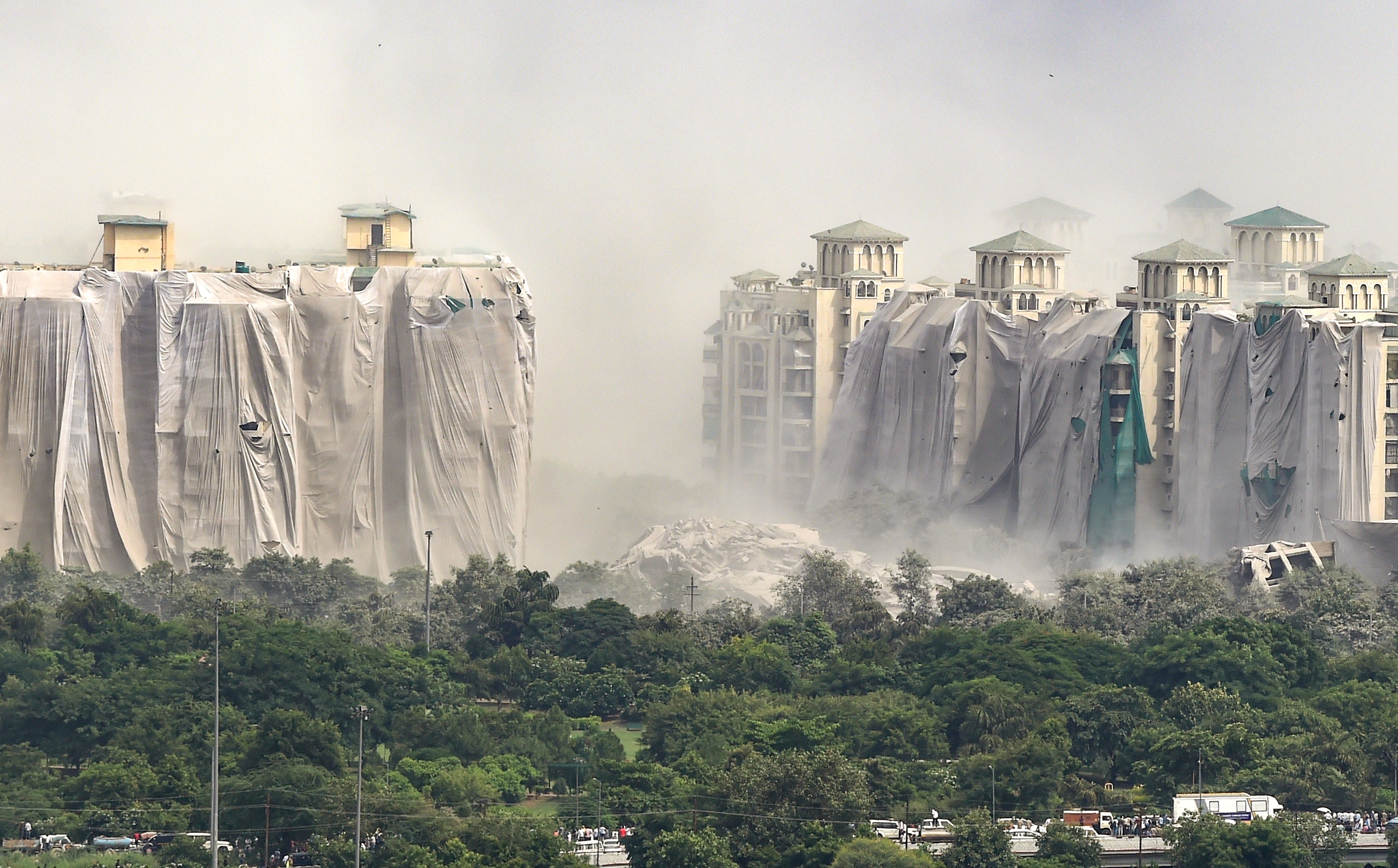 Noida: Demolition of Supertech's twin towers on, Sunday. Over 3,700 kg explosives were used to bring down the structures. (PTI)