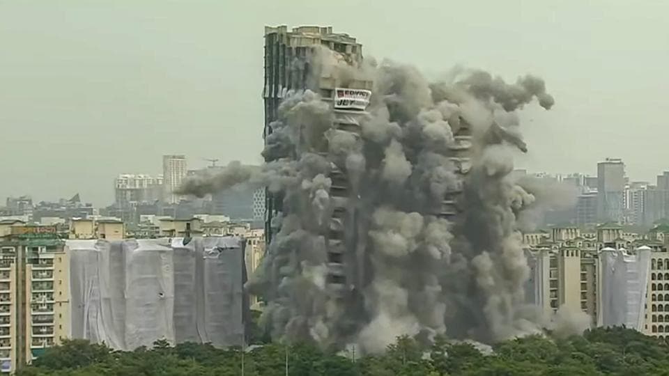 A final check of explosives and related arrangements were done before the Supertech twin towers were demolished. (PTI) (HT_PRINT) A final check of explosives and related arrangements were done before the Supertech twin towers were demolished. (PTI) (HT_PRINT)