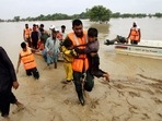 Army troops evacuate people from a flood-hit area in Rajanpur, district of Punjab in Pakistan. Army troops evacuate people from a flood-hit area in Rajanpur, district of Punjab in Pakistan. 