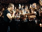 The image shows Coldplay's Chris Martin drawing a tattoo for fan while performing 'Fix You'.(Twitter/@MattieJolleyAFC) The image shows Coldplay's Chris Martin drawing a tattoo for fan while performing 'Fix You'.(Twitter/@MattieJolleyAFC)