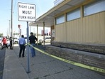 Detroit Police and investigators look over a homicide scene on Wyoming Avenue, near the corner of Seven Mile Road, Sunday, in Detroit. (Detroit News via AP) Detroit Police and investigators look over a homicide scene on Wyoming Avenue, near the corner of Seven Mile Road, Sunday, in Detroit. (Detroit News via AP)