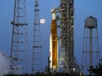 FILE - The moon sets in front of the NASA Artemis rocket with the Orion spacecraft aboard on pad 39B at the Kennedy Space Center, in Cape Canaveral, Florida.&nbsp;(AP)