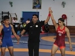 Antim Panghal (blue) and Vinesh Phogat (red) in action in trials in Lucknow on Monday.(SAI) Antim Panghal (blue) and Vinesh Phogat (red) in action in trials in Lucknow on Monday.(SAI)