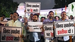 AAP MLAs holds a protest demanding the resignation of Delhi Delhi LG Vinay Kumar Saxena, at Vidhan sabha in New Delhi on Monday.&nbsp;