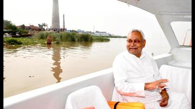 Bihar chief minister Nitish Kumar rides a boat during his visit to Raghopur in Vaishali on Monday. (Santosh Kumar/HT Photo) Bihar chief minister Nitish Kumar rides a boat during his visit to Raghopur in Vaishali on Monday. (Santosh Kumar/HT Photo)