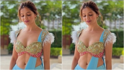 Rubina styled her pallu differently and wore it through her blouse as she posed for the pictures. In golden ear studs, rings and a golden bracelet from the shelves of House of Tuhina, Rubina accessorised her look to perfection. (Instagram/@rubinadilaik)