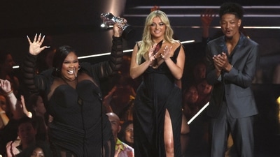 Lizzo accepts the award for Video For Good for About Damn Time as Bebe Rexha looks on at MTV VMAs. (REUTERS) 