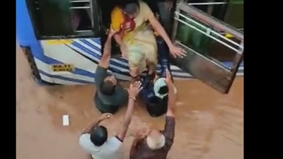 Passengers including women and children who got stuck inside the bus were rescued by the locals. (Screengrab from Twitter video)