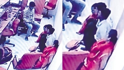 CCTV footage shows one of the robbers with hostages. (HT_Print)