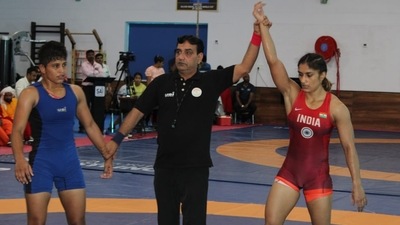Antim Panghal (blue) and Vinesh Phogat (red) in action in trials in Lucknow on Monday. (SAI) Antim Panghal (blue) and Vinesh Phogat (red) in action in trials in Lucknow on Monday. (SAI)