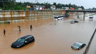 Vehicles stranded on the flooded underpass on Bengaluru-Mysuru highway, in Ramanagara . (ANI) Vehicles stranded on the flooded underpass on Bengaluru-Mysuru highway, in Ramanagara . (ANI)