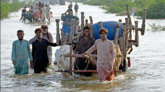 The floods have forced the Pakistan government to divert scarce resources to relief operations at a time when Islamabad is engaged in protracted negotiations with IMF for a bailout package. (AFP)