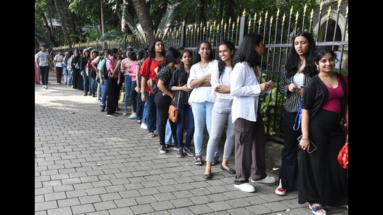 College students wait in a queue to enter St. Xavier's College for the annual Malhar festival on Monday (Bhushan Koyande/HT Photo)