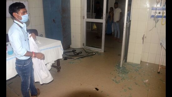 The damaged glass door of the emergency room at SRN Hospital on Monday. (HT PHOTO)