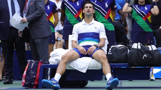 Serbia's Novak Djokovic sits in his courtside chair&nbsp;