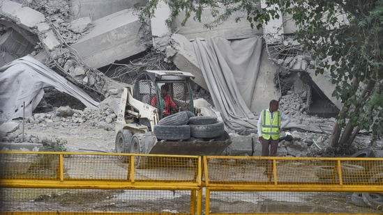 Workers near debris of the demolished twin towers of Supertech, in Noida on Monday, August 29, 2022. (PTI Photo/Atul Yadav) Workers near debris of the demolished twin towers of Supertech, in Noida on Monday, August 29, 2022. (PTI Photo/Atul Yadav)