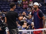 Nick Kyrgios, right, of Australia, shakes hands with Thanasi Kokkinakis, of Australia, during the first round of the US Open tennis championships, Monday, Aug. 29, 2022, in New York.