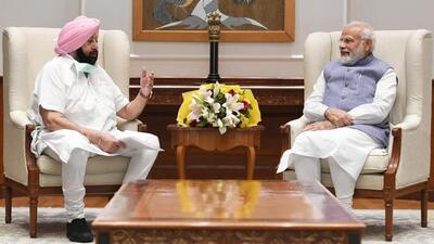 Punjab Lok Congress leader and former chief minister Captain Amarinder Singh with Prime Minister Narendra Modi in New Delhi on Tuesday. (HT Photo)