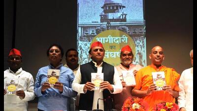 SP chief Akhilesh Yadav released a book ‘Bhagidari ka Sangharsh’, written by Shri Kamal Kishore Katheria, at the Samajwadi Party state unit office on Tuesday. (Sourced)