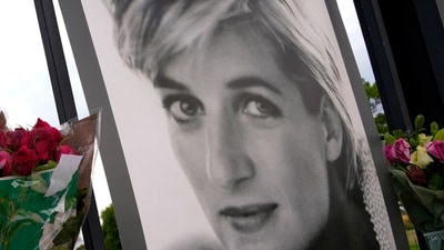 Flowers and a portrait of Princess Diana are displayed on the gates of Kensington Palace, in London, Tuesday, Aug. 30, 2022. This week marks the 25th anniversary of Princess Diana's death in a Paris car crash. (AP) Flowers and a portrait of Princess Diana are displayed on the gates of Kensington Palace, in London, Tuesday, Aug. 30, 2022. This week marks the 25th anniversary of Princess Diana's death in a Paris car crash. (AP)