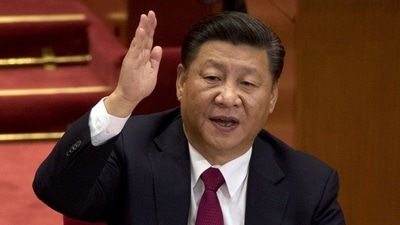 Chinese President Xi Jinping raises his hand to show approval of a work report during the closing ceremony for the 19th Party Congress in Beijing. (AP file) Chinese President Xi Jinping raises his hand to show approval of a work report during the closing ceremony for the 19th Party Congress in Beijing. (AP file)
