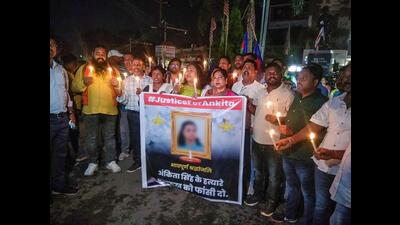 People take out a candle light march in protest against the death of a Class 12 student in Jharkhand's Dumka district, in Ranchi on Monday. (PTI) People take out a candle light march in protest against the death of a Class 12 student in Jharkhand's Dumka district, in Ranchi on Monday. (PTI)