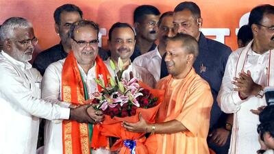 Uttar Pradesh chief minister Yogi Adityanath welcomed the newly appointed sate BJP chief Bhupendra Singh Chaudhary at the party office in Lucknow on Monday. (ANI) Uttar Pradesh chief minister Yogi Adityanath welcomed the newly appointed sate BJP chief Bhupendra Singh Chaudhary at the party office in Lucknow on Monday. (ANI)