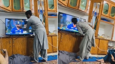 An Afghanistan cricket fan kisses Hardik Pandya through the TV screen (Twitter)