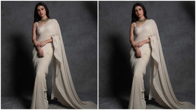 Mouni teamed the six yards with a statement blouse piece featuring broad straps, a sweetheart neckline, bodycon silhouette, cropped hem, patti borders, heavy embellishments, and contrasting pink-hued thread embroidery. (Instagram) Mouni teamed the six yards with a statement blouse piece featuring broad straps, a sweetheart neckline, bodycon silhouette, cropped hem, patti borders, heavy embellishments, and contrasting pink-hued thread embroidery. (Instagram)