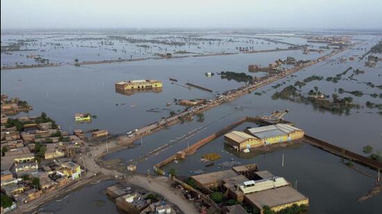 Homes are surrounded by floodwaters in Sohbat Pur city, a district of Pakistan’s southwestern Baluchistan province, on Monday. (AP)