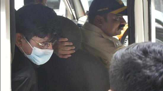 Actor Kamaal R Khan being taken to a Borivali court on Tuesday Vijay Bate/HT Photo