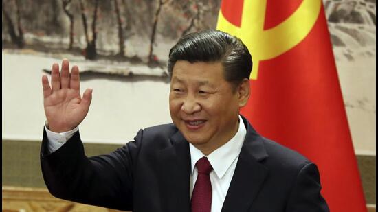 Chinese President Xi Jinping waves during a press event to introduce the new members of the Chinese politburo at the Great Hall of the People in Beijing on October 25, 2017. (AP)