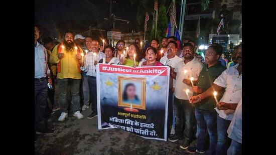 People take out a candle light march in protest against the death of a Class 12 student in Jharkhand's Dumka district, in Ranchi on Monday. (PTI)