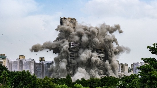 The twin towers of Supertech Ltd. during the demolition in Noida, India, on Sunday, August 28, 2022. (Photographer: T. Narayan/Bloomberg)