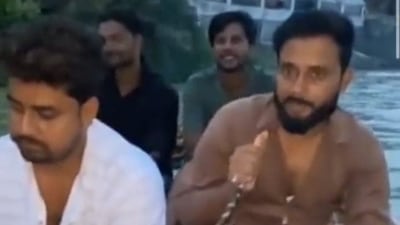 A screen grab of the video clip of the young men picnicking on the Ganga. (HT Photo) A screen grab of the video clip of the young men picnicking on the Ganga. (HT Photo)