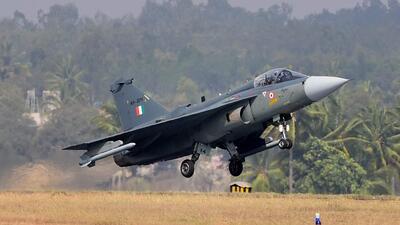 Bengaluru : Indian Air Force's Light Combat aircraft Tejas takes off during the inauguration of the 11th biennial edition of AERO INDIA 2017 at Yelahanka Air base in Bengaluru on Tuesday. PTI Photo by Shailendra Bhojak(PTI2_14_2017_000089a) (for Shishir Gupta’s story) (PTI) Bengaluru : Indian Air Force's Light Combat aircraft Tejas takes off during the inauguration of the 11th biennial edition of AERO INDIA 2017 at Yelahanka Air base in Bengaluru on Tuesday. PTI Photo by Shailendra Bhojak(PTI2_14_2017_000089a) (for Shishir Gupta’s story) (PTI)