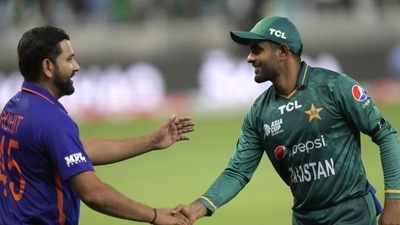Pakistan's captain Babar Azam, right, shake hands with India's captain Rohit Sharma (AP) Pakistan's captain Babar Azam, right, shake hands with India's captain Rohit Sharma (AP)