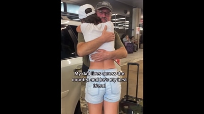 The image, taken from the Instagram video, shows the daughter hugging her dad. (Instagram/@kt.gham)