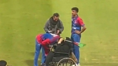 Mohammad Nabi with Afghanistan fan Gulpari Safi (Twitter) Mohammad Nabi with Afghanistan fan Gulpari Safi (Twitter)