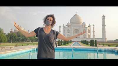 A foreign tourist in front of the Taj Mahal. (HT File) A foreign tourist in front of the Taj Mahal. (HT File)