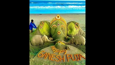 Ganesh Chaturthi 2022: The image shows the magnificent sand sculpture of Lord Ganesha created by Sudarsan Pattnaik with 3,425 ‘sand ladoos’ and some flowers. (Twitter/@sudarsansand) Ganesh Chaturthi 2022: The image shows the magnificent sand sculpture of Lord Ganesha created by Sudarsan Pattnaik with 3,425 ‘sand ladoos’ and some flowers. (Twitter/@sudarsansand)