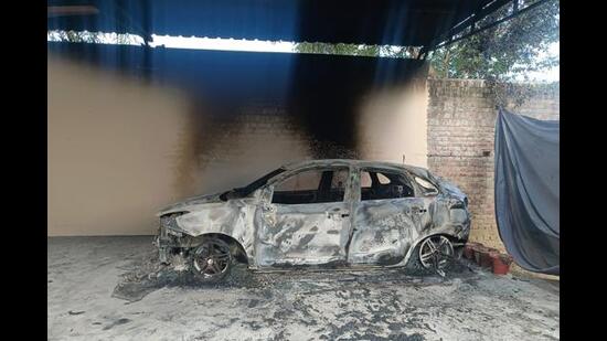 The car that the miscreants set ablaze before fleeing from the church early on Wednesday. (HT Photo)