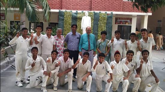 KVM team in a jubilant mood after winning the Punjab school games zonal cricket tournament held in Ludhiana. (HT PHOTO)