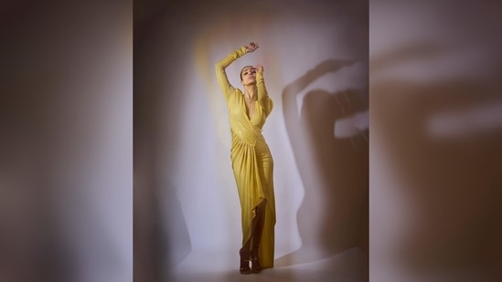 Malaika Arora's figure-grasping silhouette features a plunging v-neckline with ruched, draped waist detailing.(Instagram/@malaikaaroraofficial)