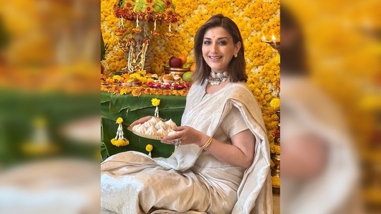Sonali Bendre brought home a small idol of Lord Ganesha made with clay. Sharing a string of images, she captioned her post, "Bappa. Modak. And my Icy."(Instagram/@sonalibendre)